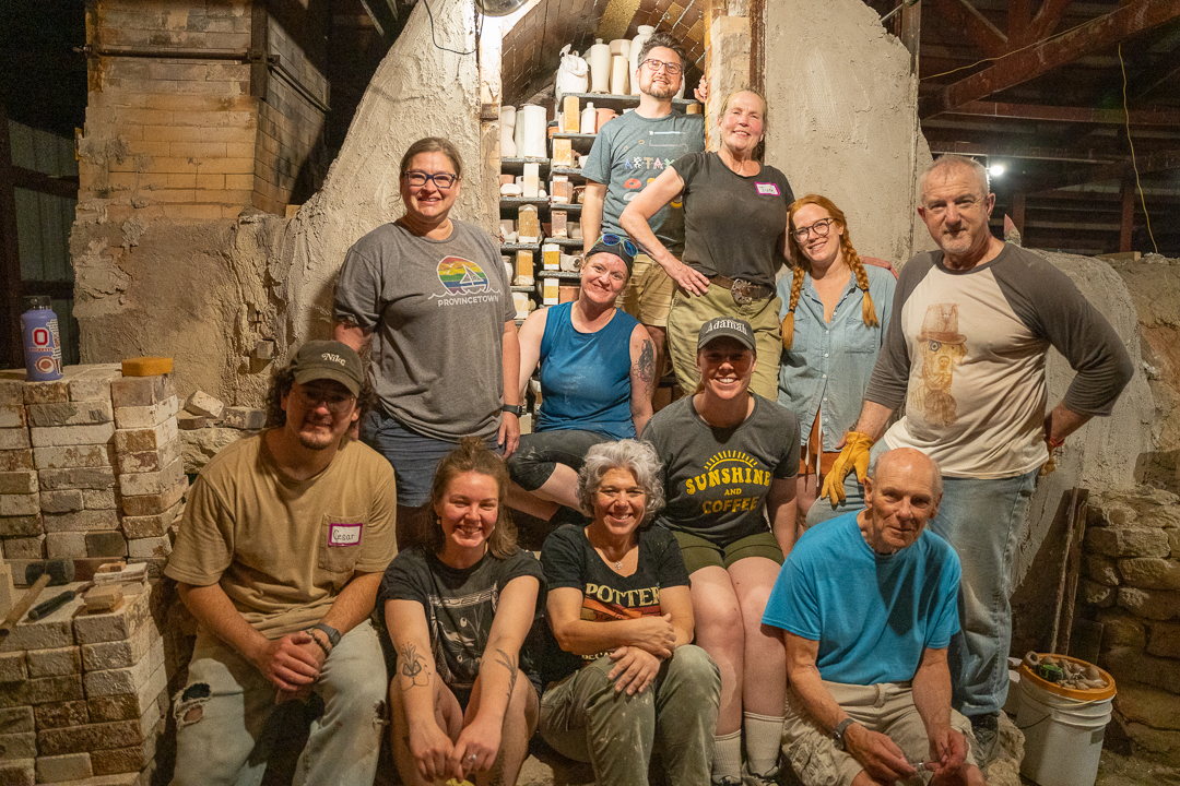 Community wood-fire kiln firing with fellow potters