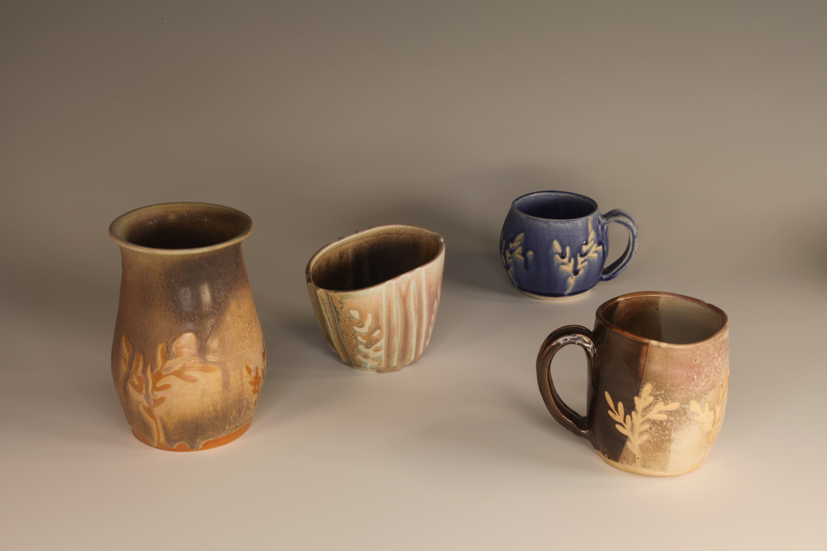 Grouped stoneware vessels with atmospheric glaze variation